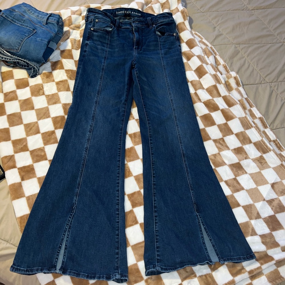 Flare jeans with slit in front.